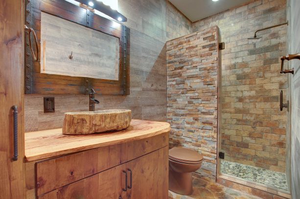 man cave bathroom using five different tiles and stones
