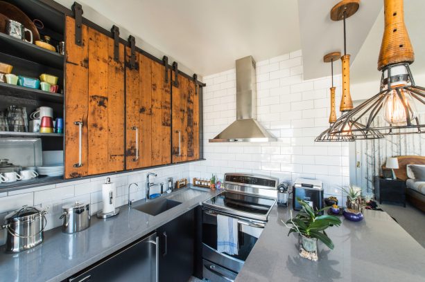 reclaimed wood sliding kitchen cabinet door with metal hardware
