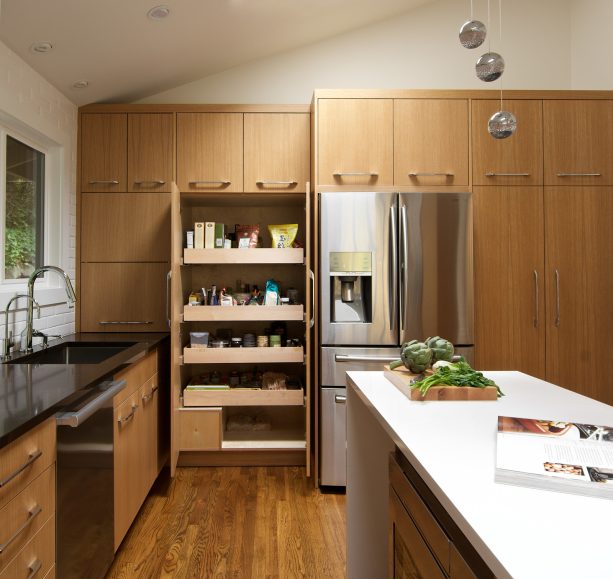 rift cut white oak cabinets with polished black and white quartz countertops