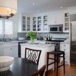 small l-shaped kitchen layout in a traditional style with a white island