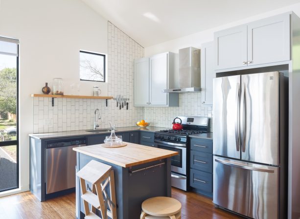 small transitional l-shaped kitchen with a square shaped island