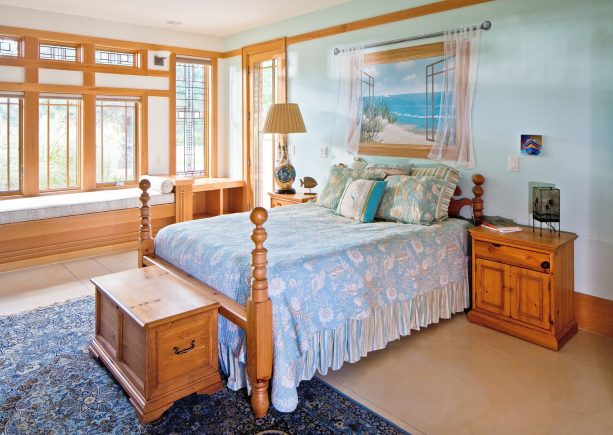 soft blue walls that look nice with honey oak trim in an arts and crafts bedroom