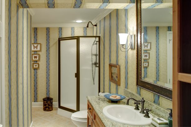 timeless man cave bathroom with elegant wallpaper