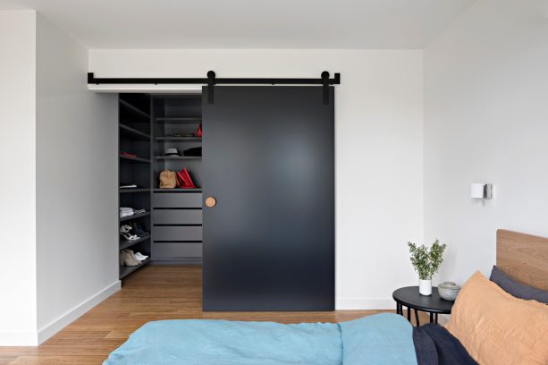 black polished single sliding walk-in closet door
