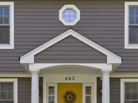 classic entryway with single recessed panel yellow front door
