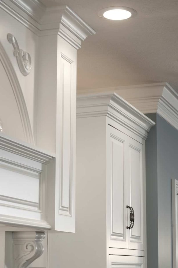 crown molding as a cabinet trim with an upside down baseboard below
