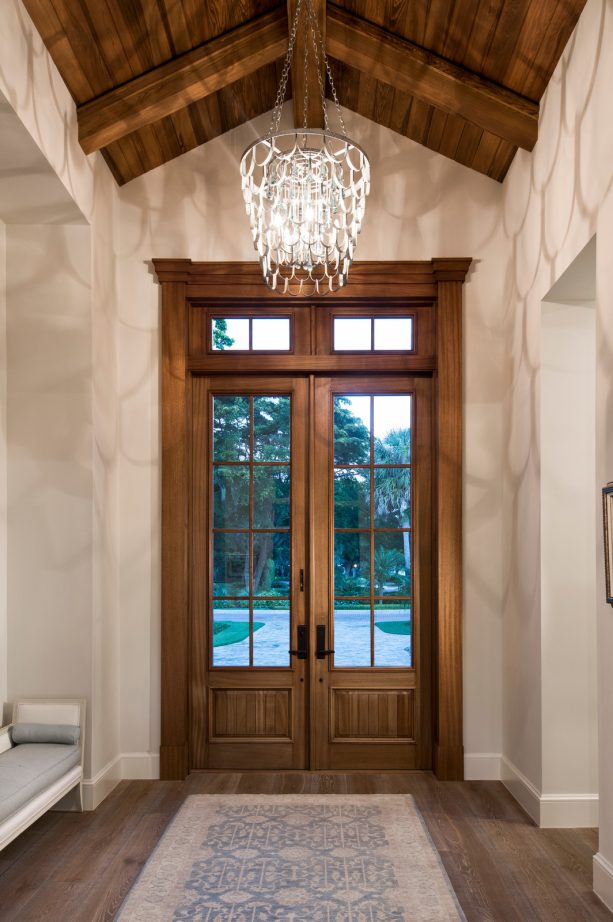 elegant brown front doors with a window made of dark wood
