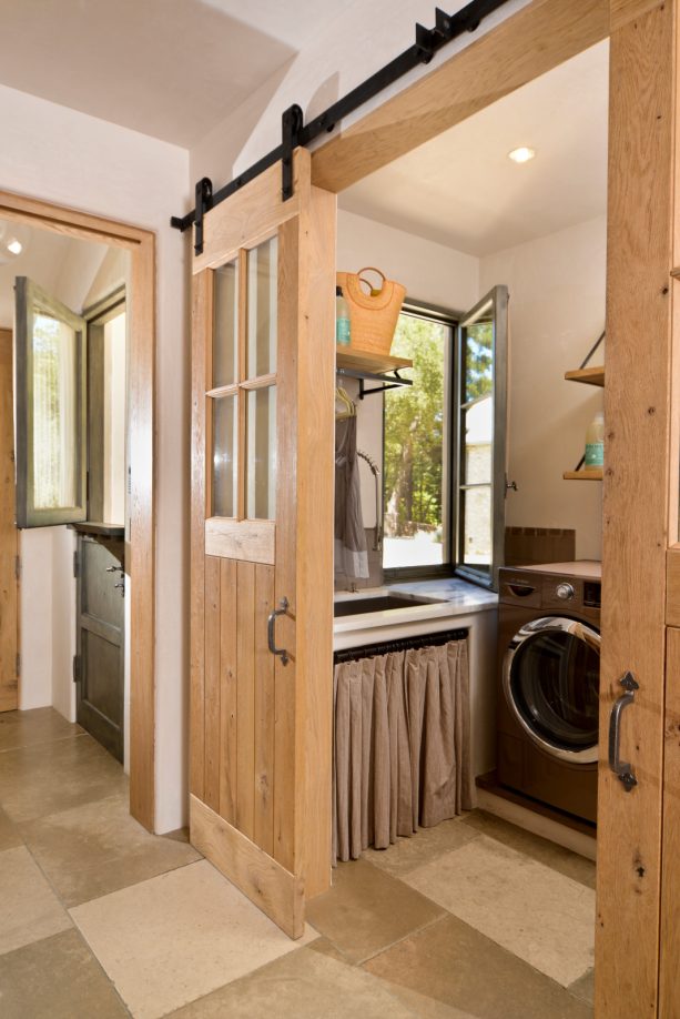 light tone wood barn doors with traditional windows style