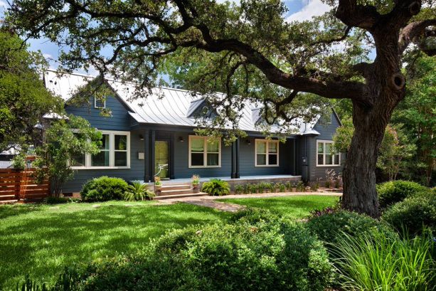 one-story ranch house with a retro colonial blue exterior color