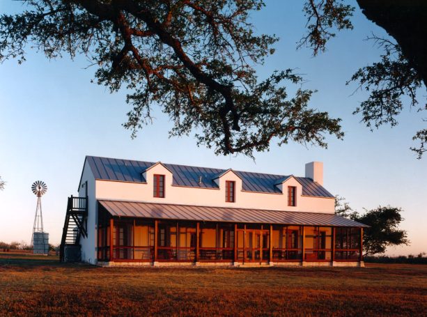 ranch house in a farmhouse style with the redwood trim exterior color