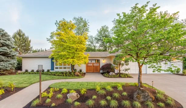 ranch house with a white wall and turquoise post exterior paint color