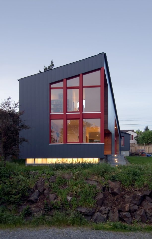 red trimmed windows in a two-story metal exterior building
