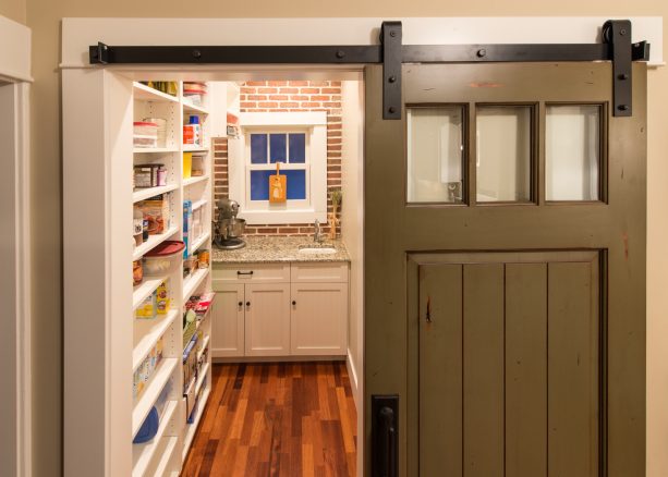 single barn door with three glass panels as a window for a small space