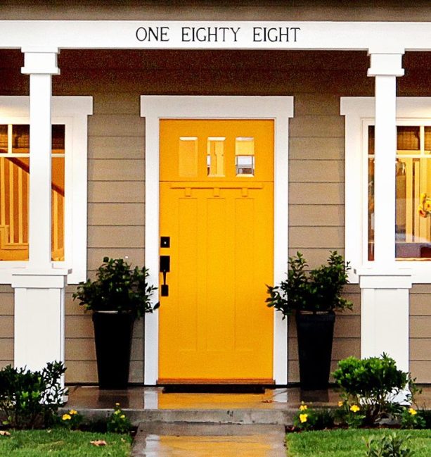 traditional craftsman front door in yellow color