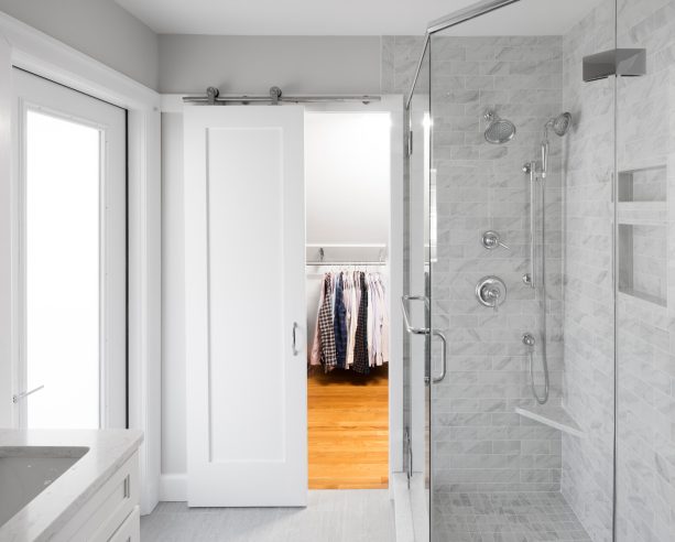 white barn door of a walk-in closet