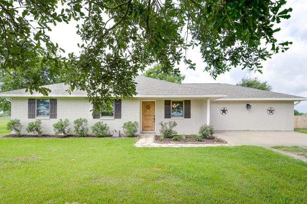 white, black, and gray exterior color combination in a small ranch house