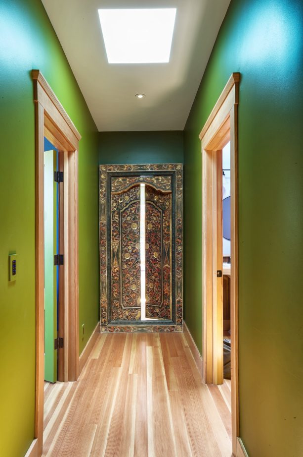 antique door in balinese style in a farmhouse hallway