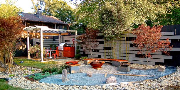 asian style patio with pea gravel ground and red fire bowl the matches the bench