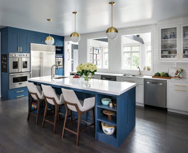 benjamin moore - van deusen blue tall cabinetry and island paired with benjamin moore - chantilly lace white kitchen cabinets for a mid-century look