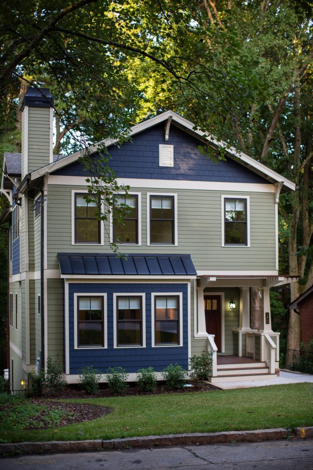 combination of dark navy blue and light green siding with a white accent color