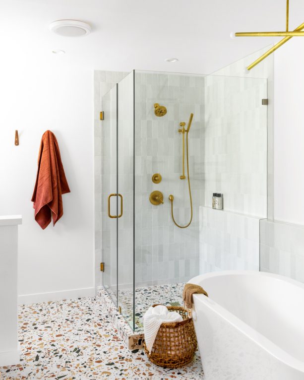 combination of gingerbread brown and gold accent color for gray and white bathroom