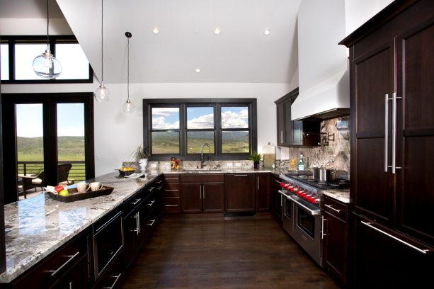 dark brown cabinets match the dark wood floor for a seamless look
