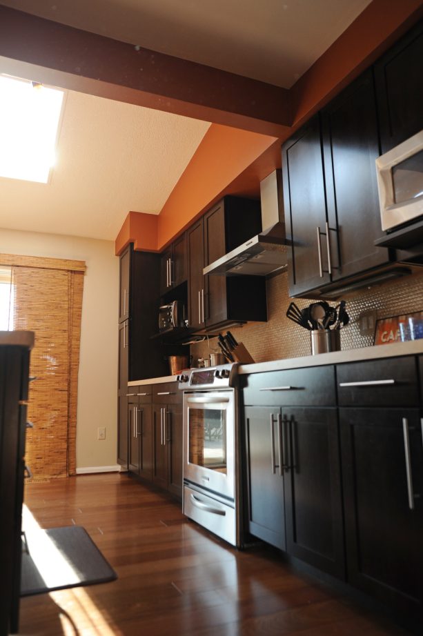 dark brown shaker style cabinets combined with metal hardware