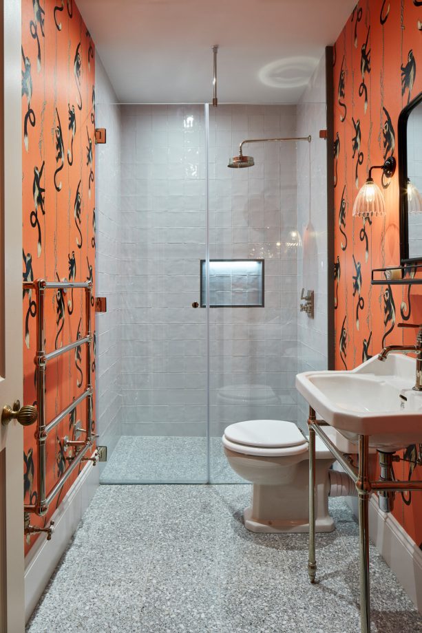 dark orange accent color for gray and white bathroom