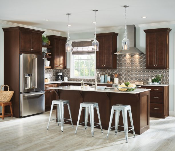 l-shaped kitchen with patterned backsplash and dark brown cabinets