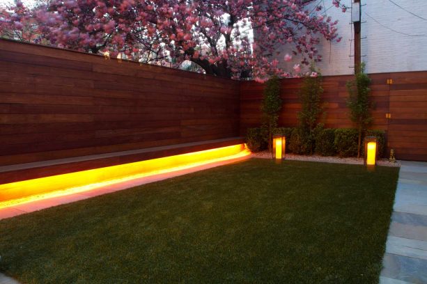 led lights beneath the built-in bench of the fence as an outdoor lighting