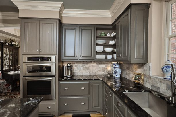 raised panel dark gray cabinets with black granite countertop