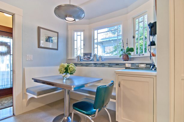 retro style breakfast nook with a floating bench and one vintage chair