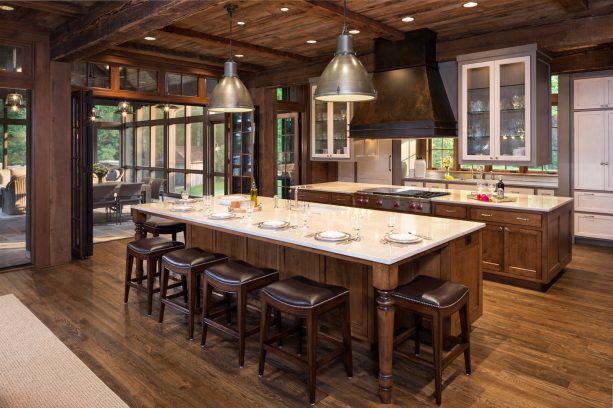 rustic kitchen with dark brown wood cabinets that blend with the surrounding