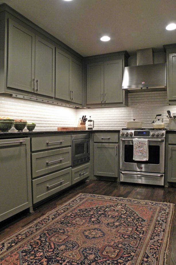 shaker cabinets in dark analytical gray from sherwin williams with oak floor