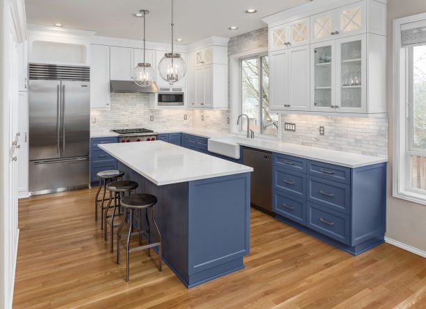 sherwin williams - distance blue lower cabinets paired with sherwin williams - extra white upper cabinets