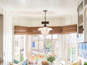 small traditional breakfast nook in a bay window with a woven shade treatment