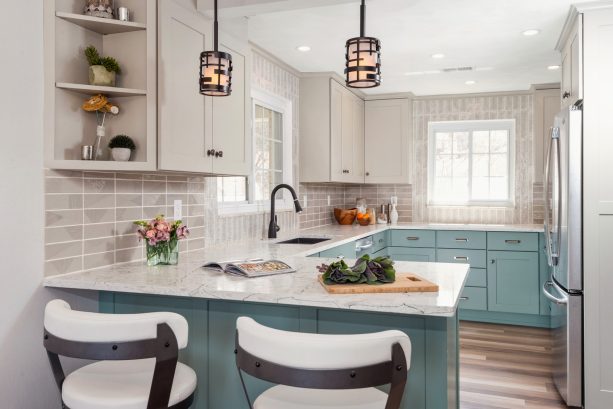 soft turquoise blue color on the base cabinets paired with sleek white upper cabinets to create a modern look