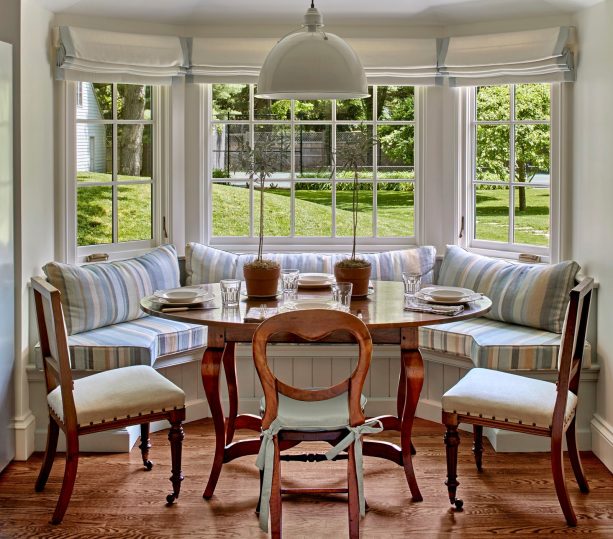 spacious bay window breakfast nook with a combination of the wood element and pastel colors