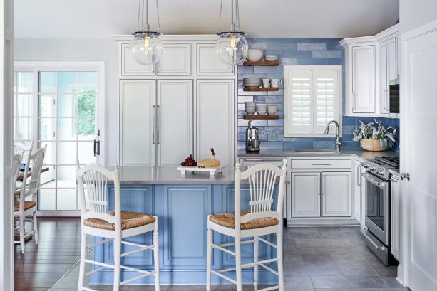 white edge glazing kitchen cabinets and wedgewood blue island cabinet in a transitional kitchen