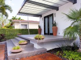 applying microdeck on top of the concrete slab to create a clean front porch look