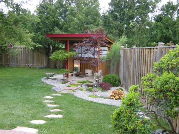 asian backyard landscaping with fully covered fence corner to create a secluded spot