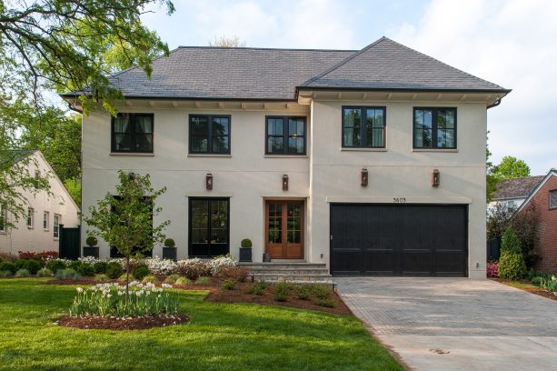 benjamin moore - exterior grade black painted trim for a three-story beige house