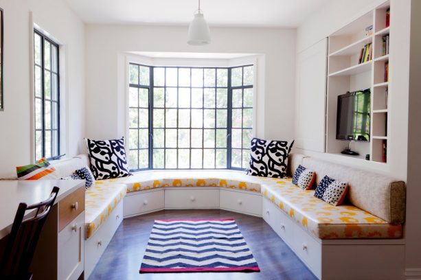 black bay windows with a crisp white trim that blends with the walls