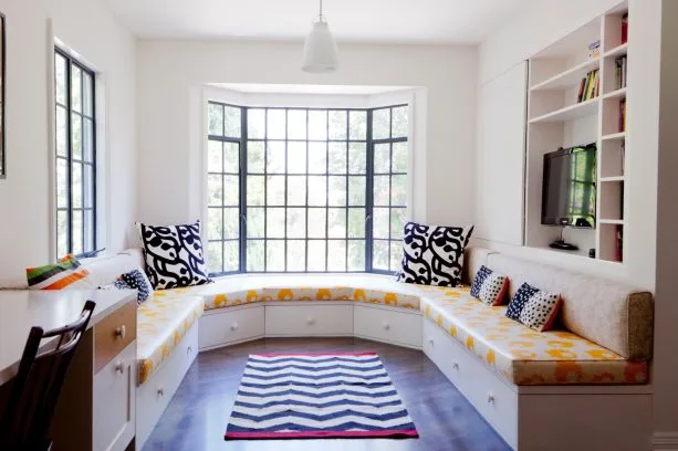 black bay windows with a crisp white trim that blends with the walls