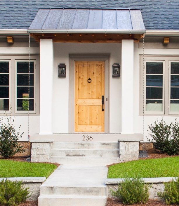 combination of metal and wood elements in a front door portico