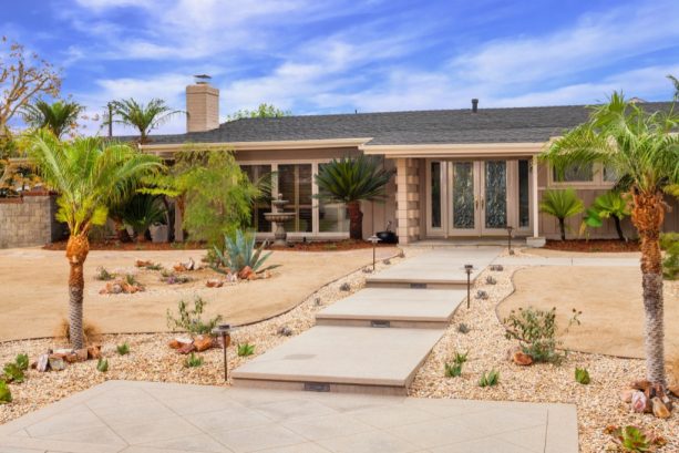 concrete paver landscaping with decomposed granite in a grassless front yard