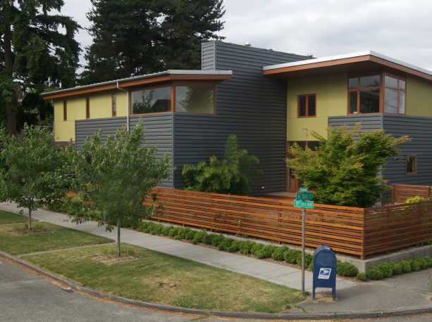 corner fence as a semi-transparent screen that matches the sheet metal siding