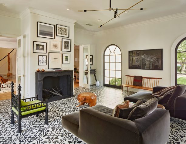 eclectic living room with black arched iron windows and white trim