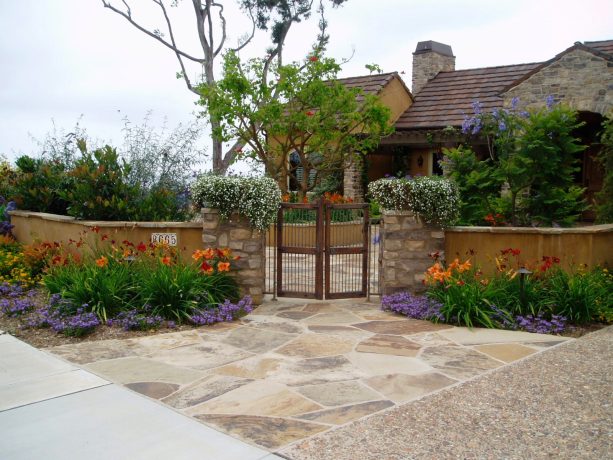 grassless front yard with cameron flagstone and pebbles in stone landscaping