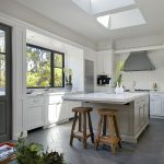 italian volcanic basalt floor tile in gray with white cabinets to create a transitional look